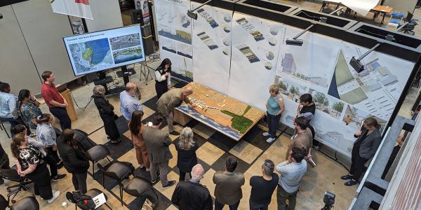 A large model of the Philadelphia waterfront displayed during an architecture thesis review
