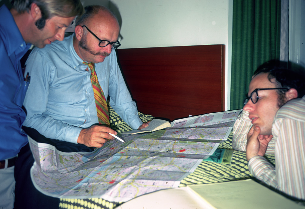 John Hill, Charles Moore and Roger Lewis plan the trip itinerary.