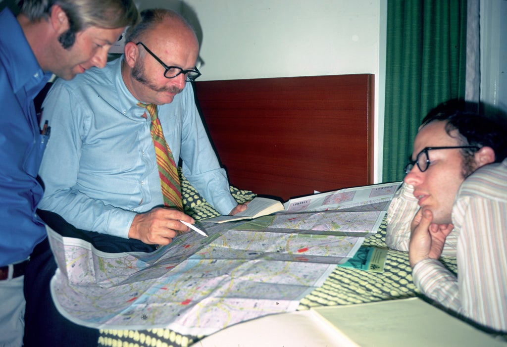 John Hill looking at a map