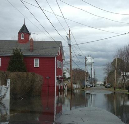 Red house on a flooded road