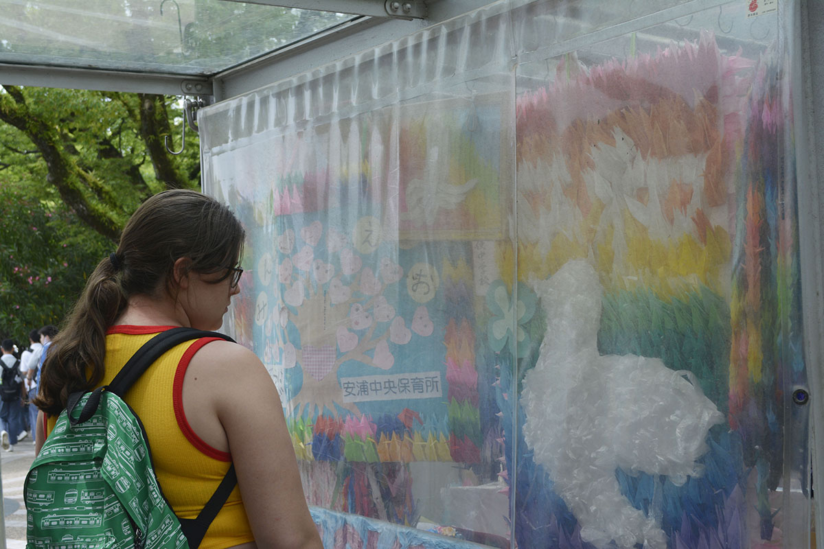 Student looking at colorful poster