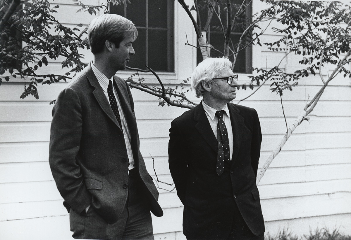 Black and white photo of two men in John Hill and Louis Kahn in suits.