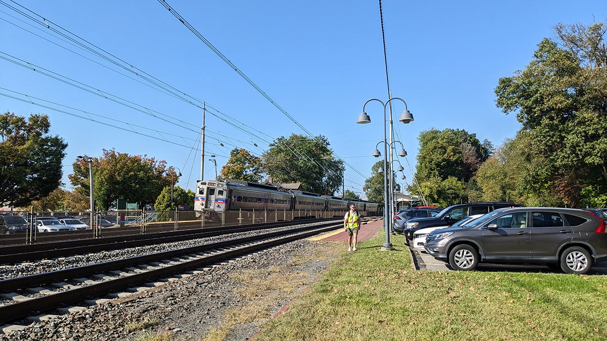 Derek Lombardi walking by train tracks