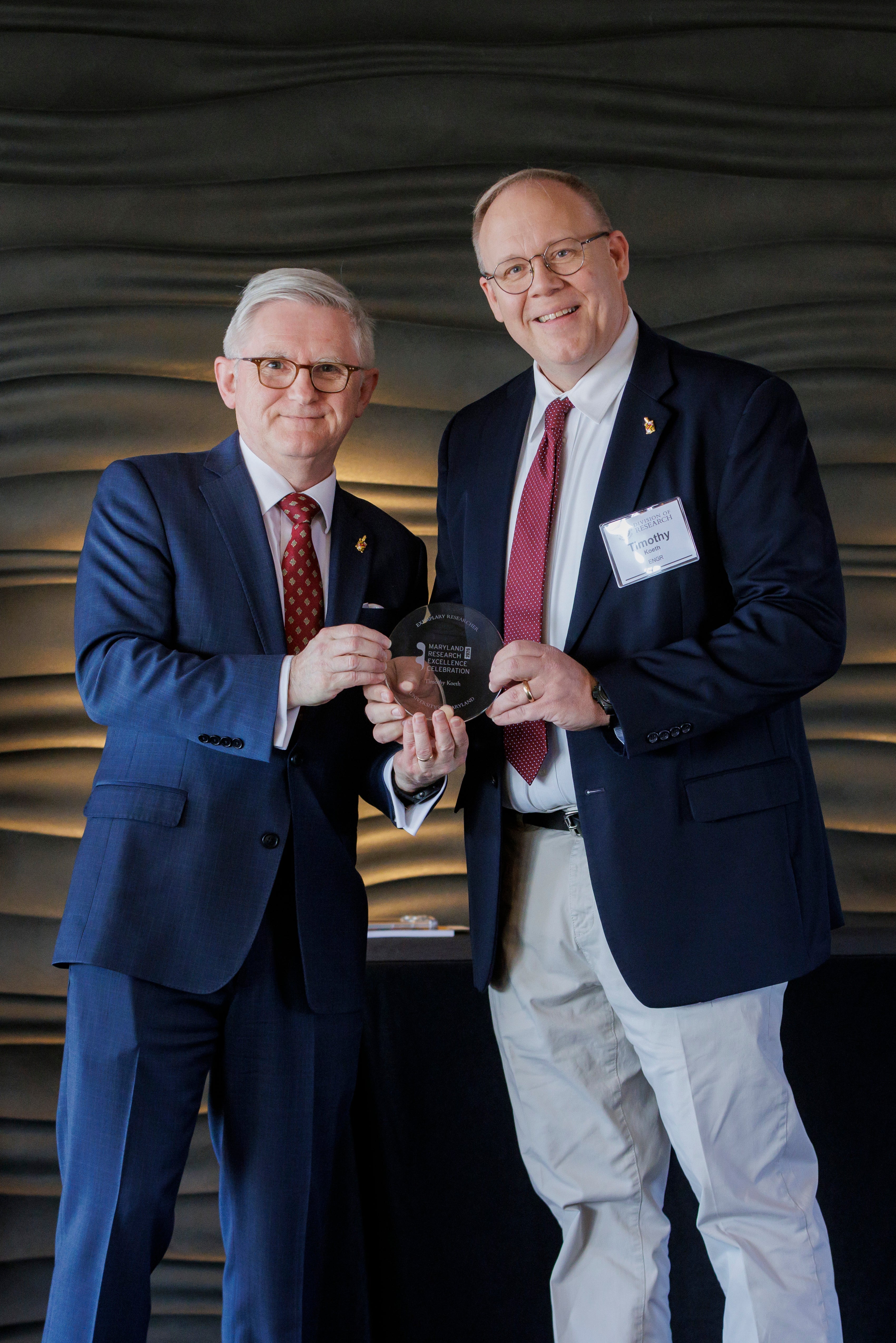 Timothy Koeth receiving award