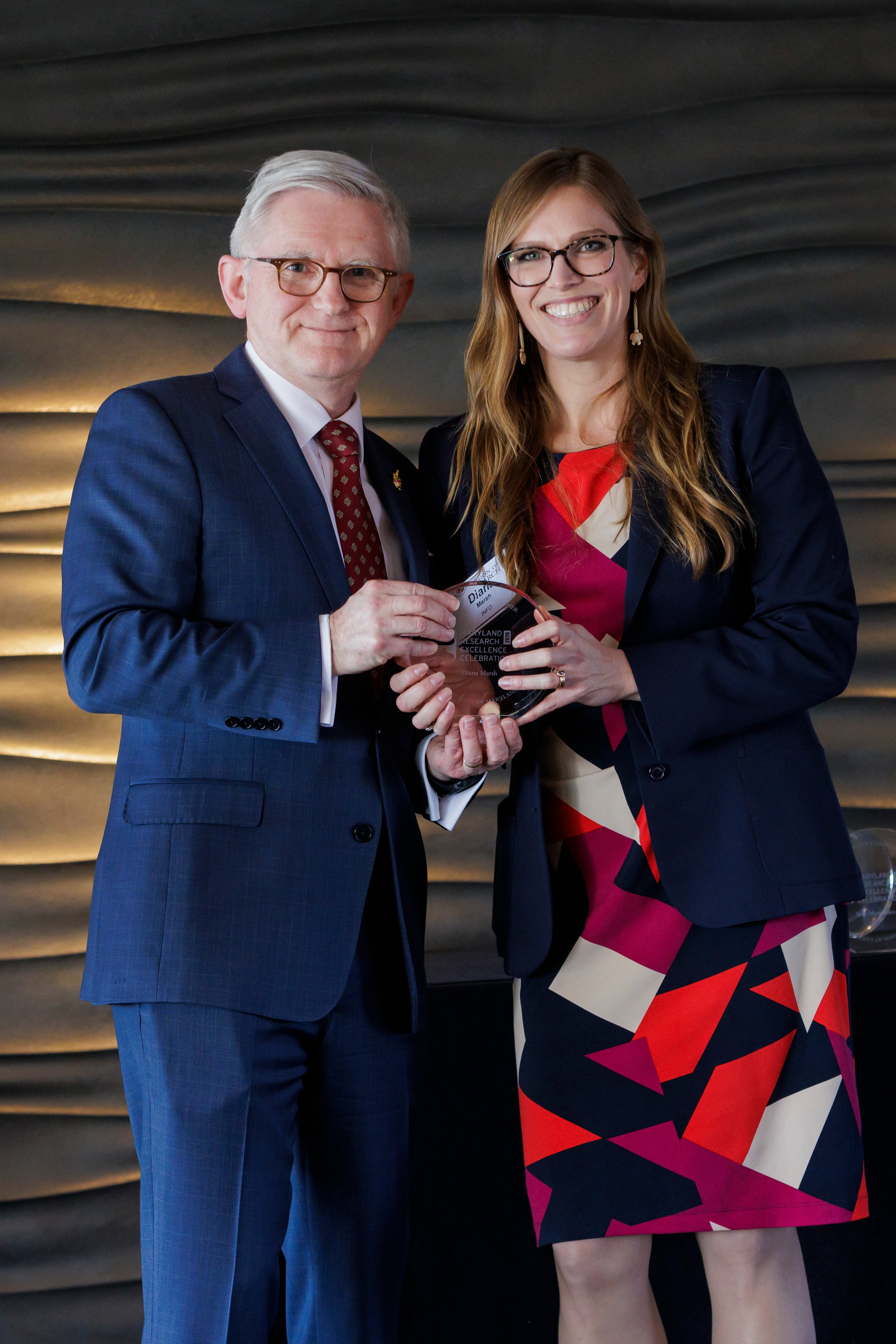 Diana E. Marsh receiving award