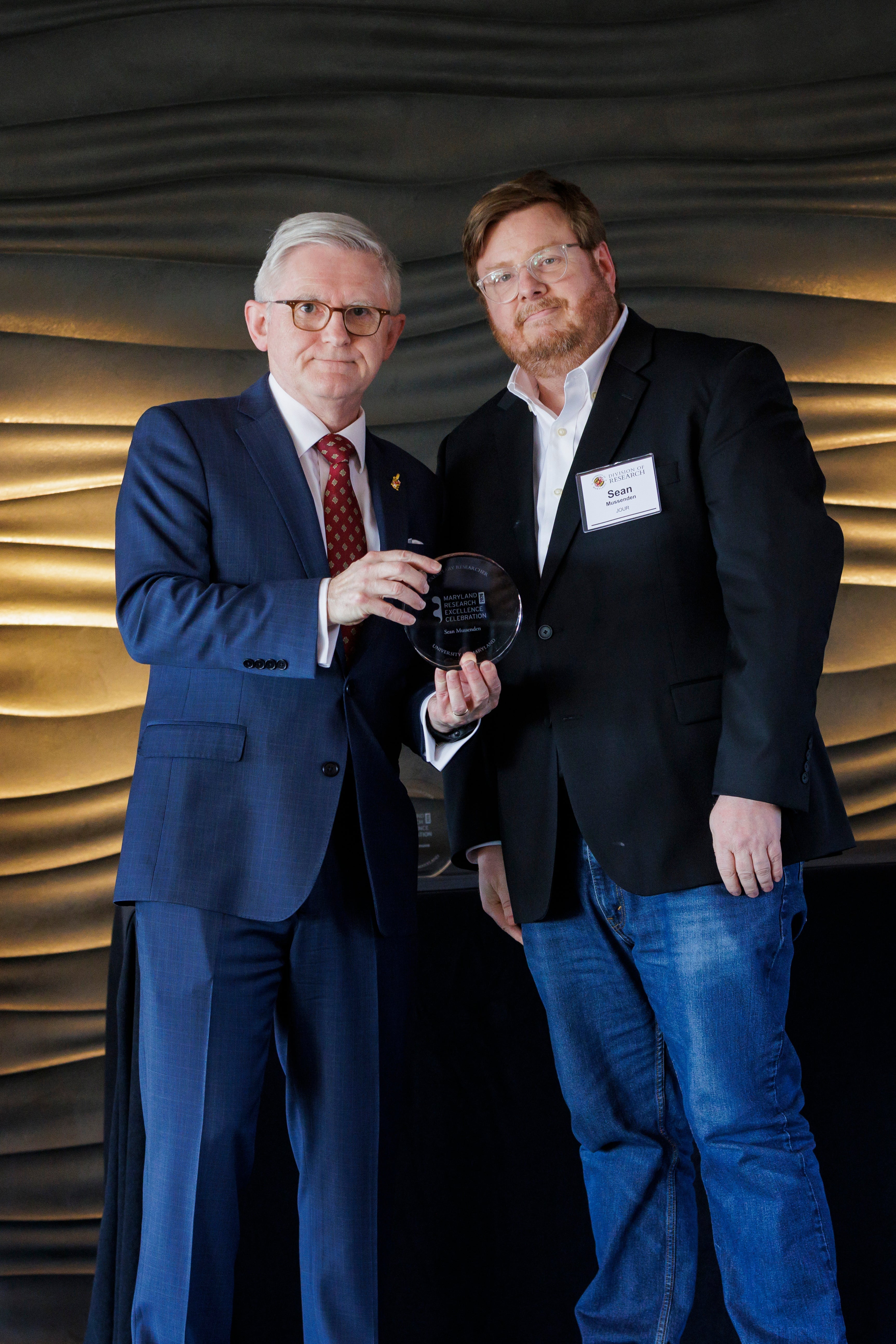 Sean Mussenden receiving award