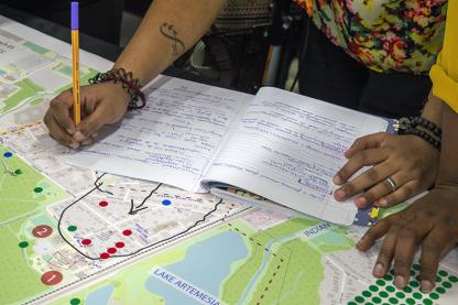 Close up of person designing a map