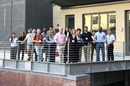 Scott Metzner on the roof with the Dean and students