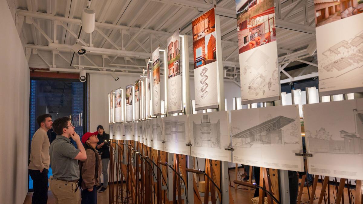 People looking at the biogenic solutions Kibel gallery exhibit installation