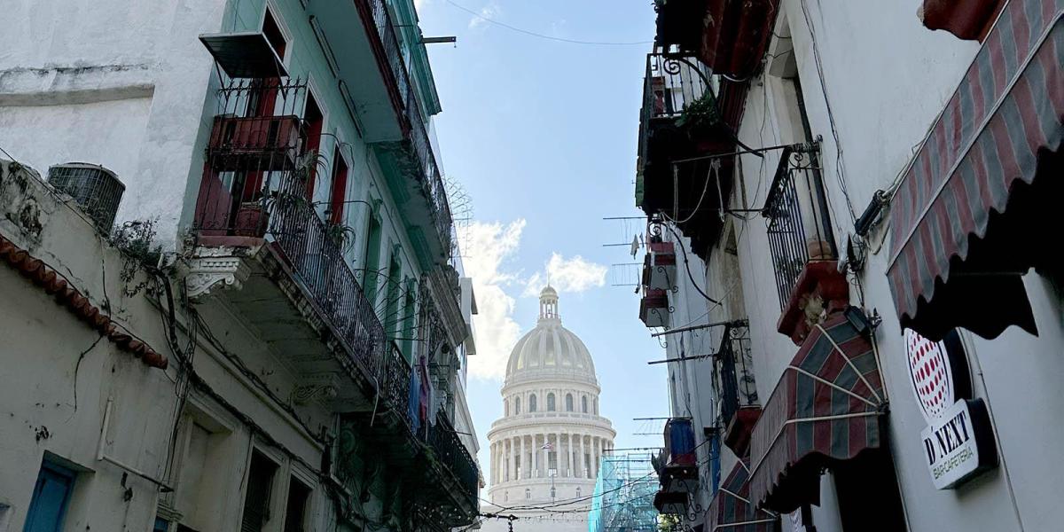 View of the Capitol between older buildings in Havana, Cuba