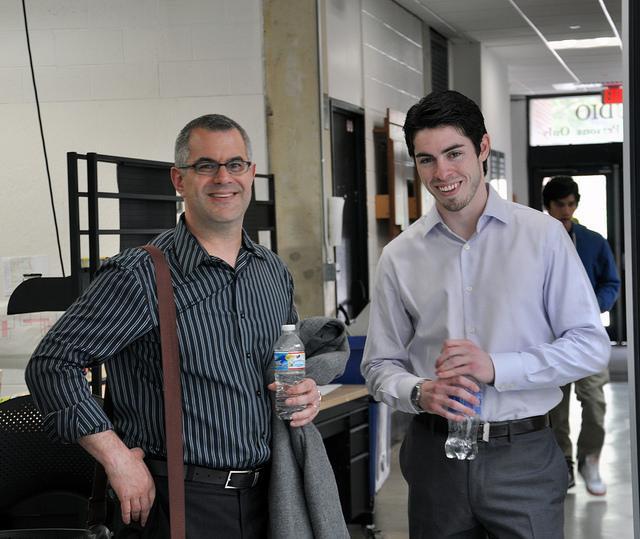 Two gentlemen smiling for a photo 