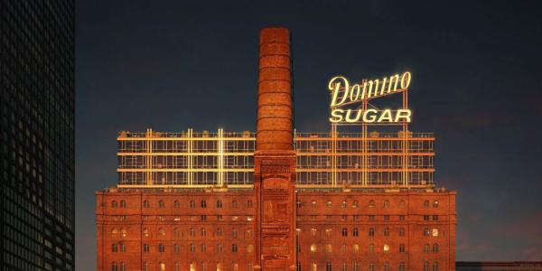 The Domino Refinery building lit up at night