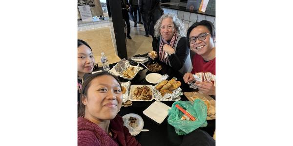 People at a table with food