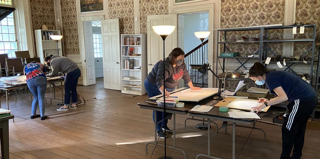 Students drafting plans in the Bostwick House.