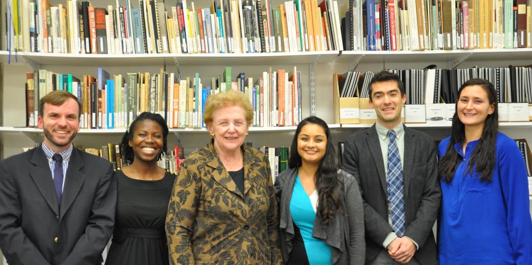 Connie Ramirez and students in front of books