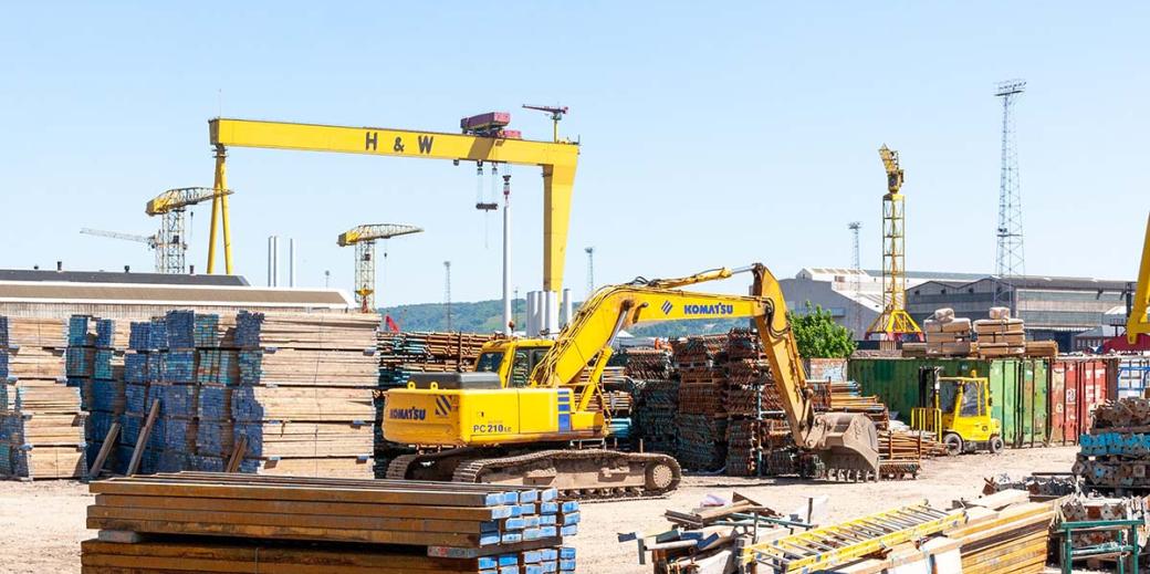 Construction site with cranes and building tools.