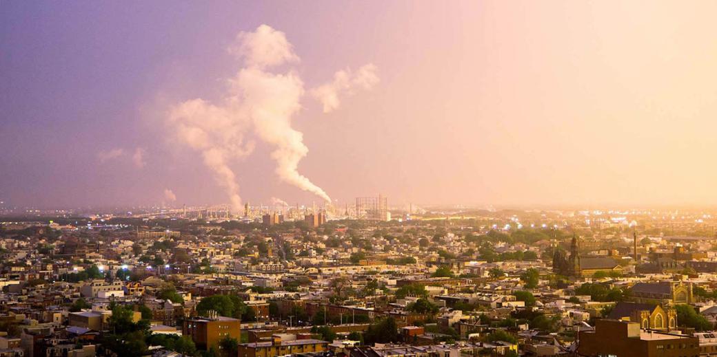 Oil refinery blowing smoke as the sun is setting in South Philly.