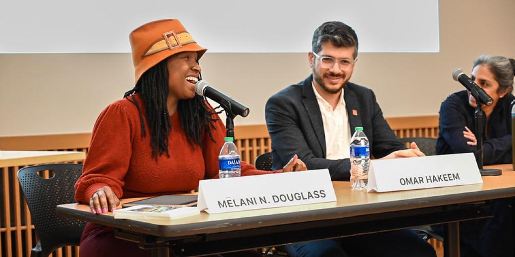 Woman with a hat laughing during her panel