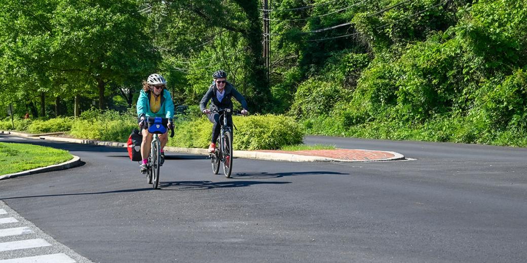 Kate Howell and Maggie Haslam biking to work