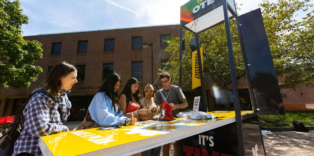 Students making buttons at the TerpsVote booth