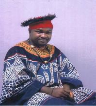 Gilbert Mbeng in the traditional Kom clothing.