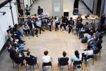 Students sitting in a circle in chairs