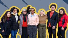 Group photo of the UEC Community Fellows with an illustrated yellow and blue background.