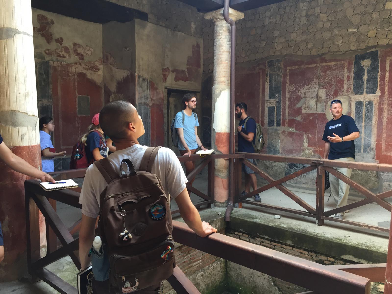 Professor Ian Sutherland leads a site visit to the beautifully preserved Villa San Marco in Stabiae.