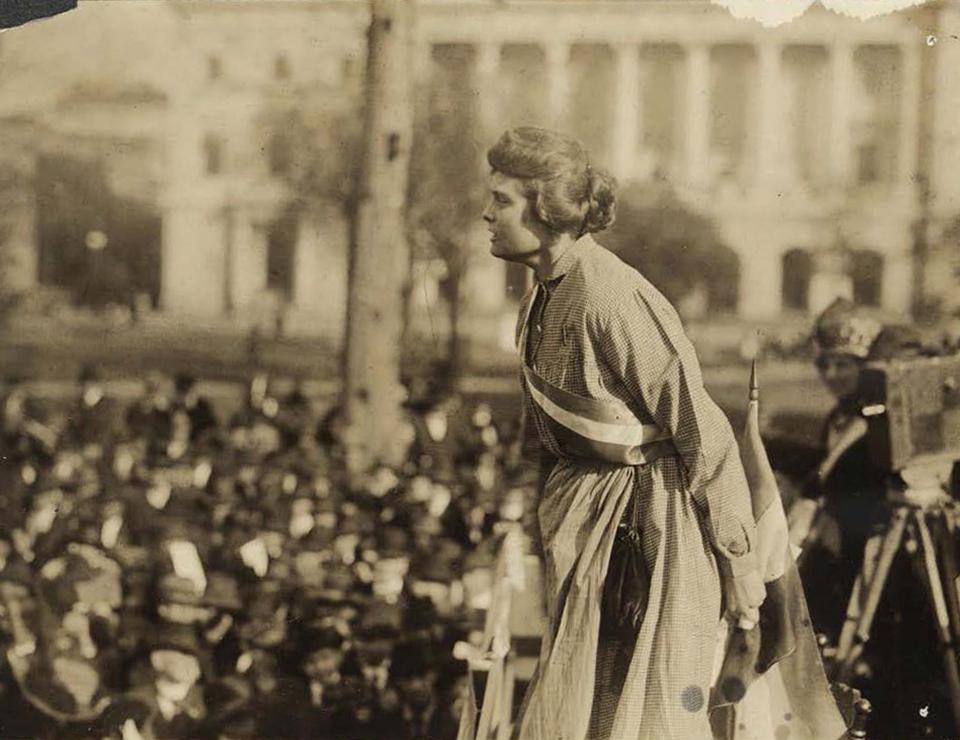 Woman addressing a crowd- old sepia photograph