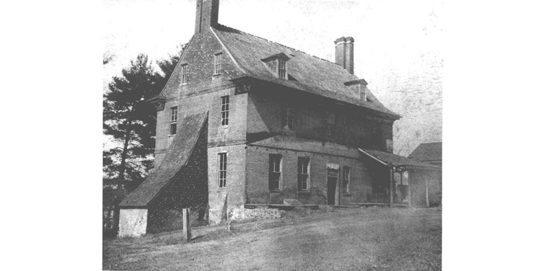 1890, black and white image of the Bostwick House, with a buttress.