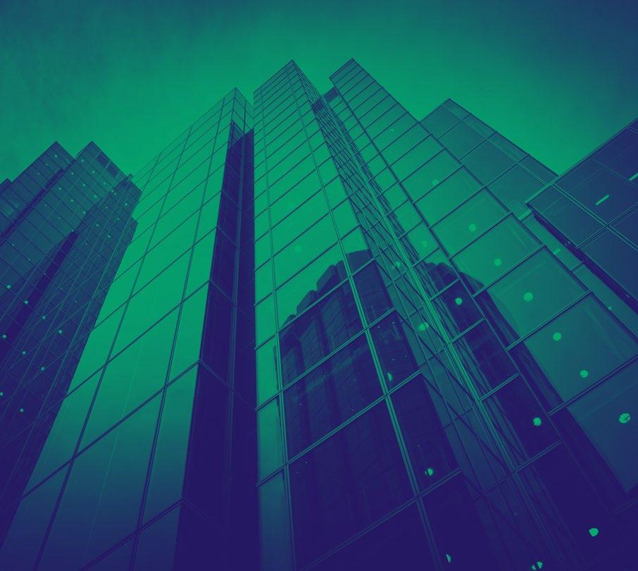 Looking up to skyscrapers, image has a blue/green filter
