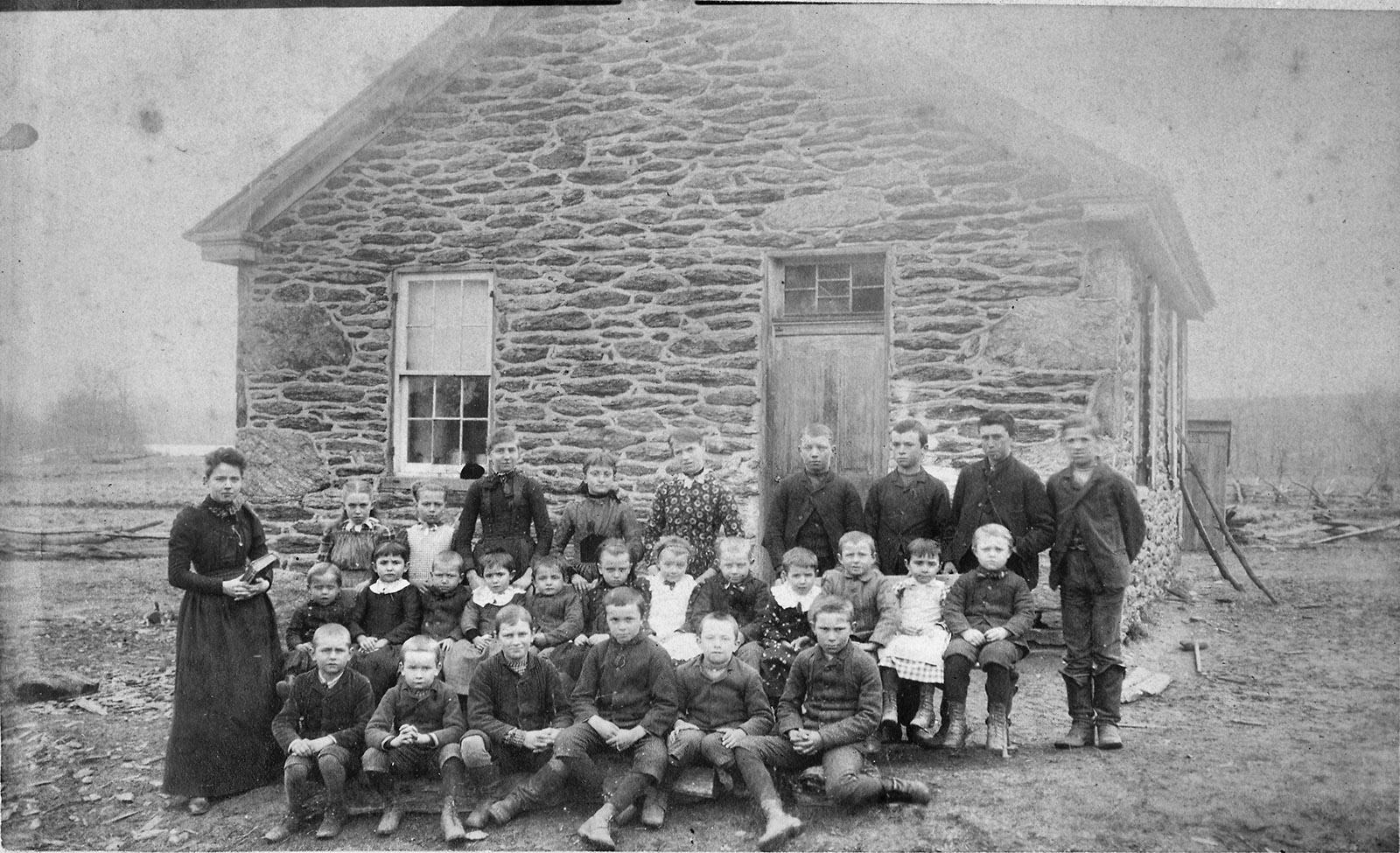 Historic B&W photo ca. 1890 of the original Hyson School. A class photo was taken each year. Courtesy of Don Linebaugh.
