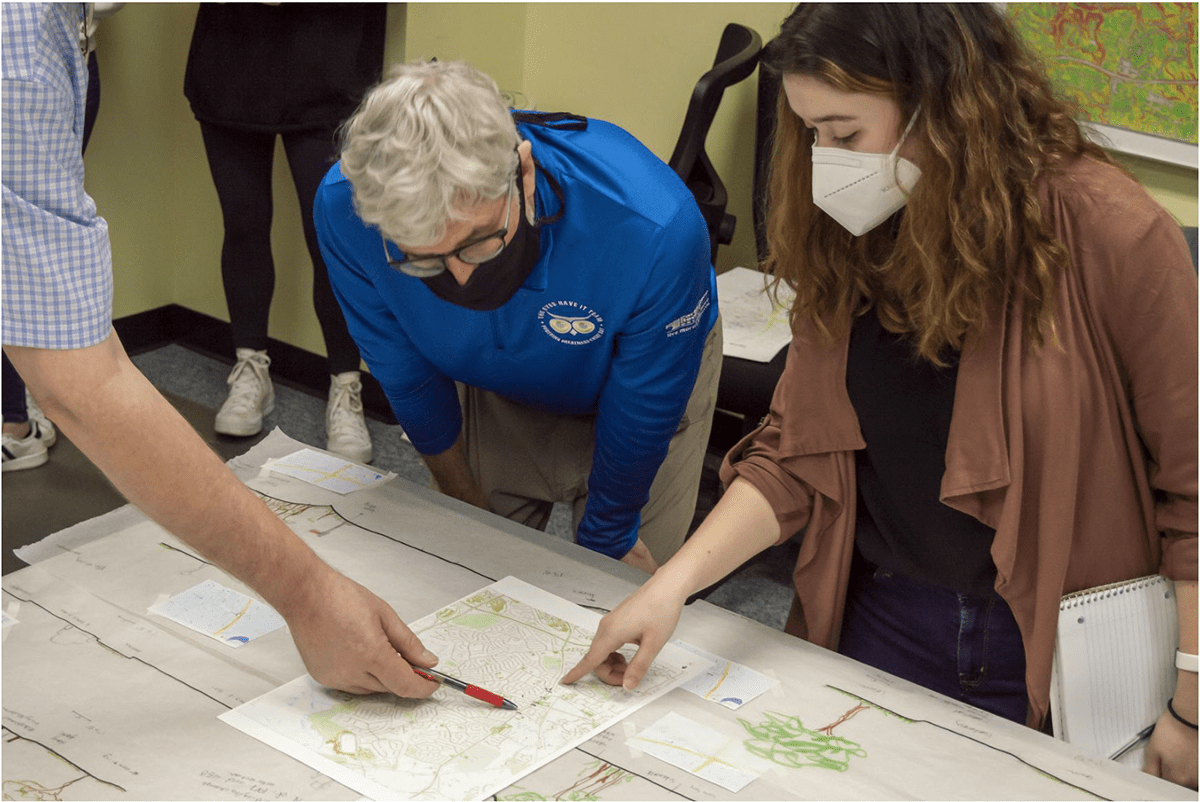 Landscape artchitect student reviewing PG county trail plans