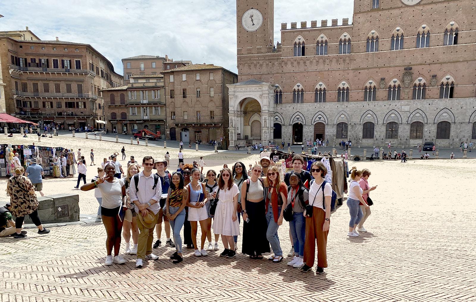 Students posing in a plaza in Siena, Italy