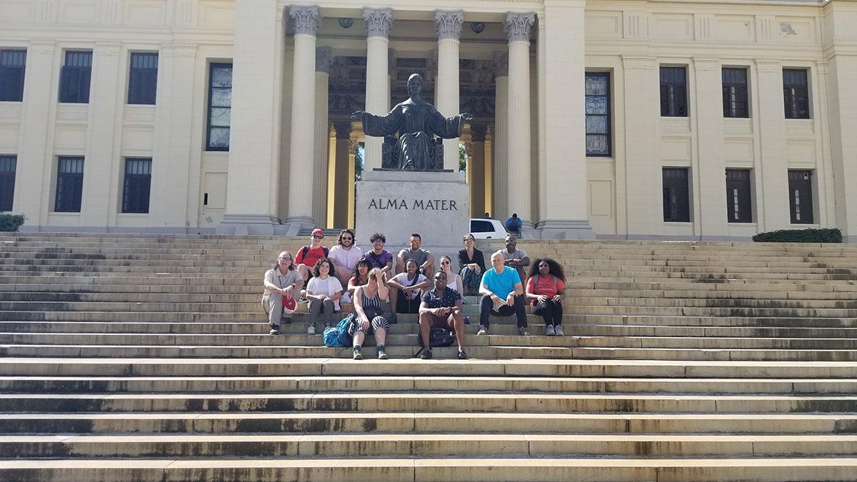 Students siting on the steps of University of Havana