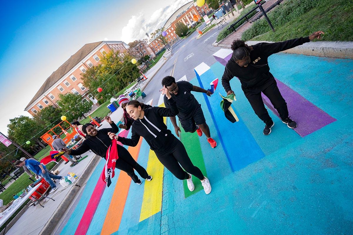 Students Dancing in colored crosswalk