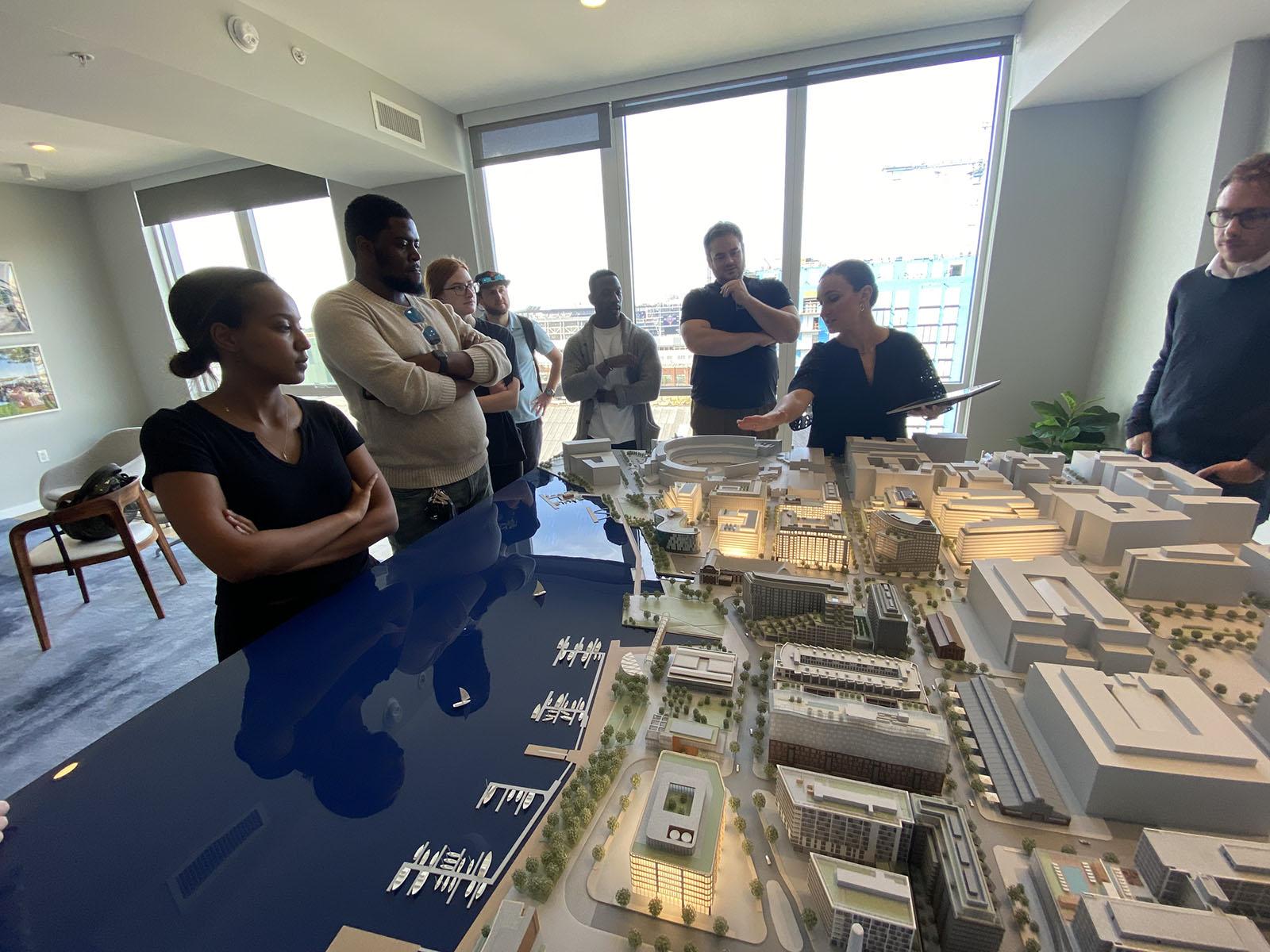 Students around a scale model of Navy Yard. 