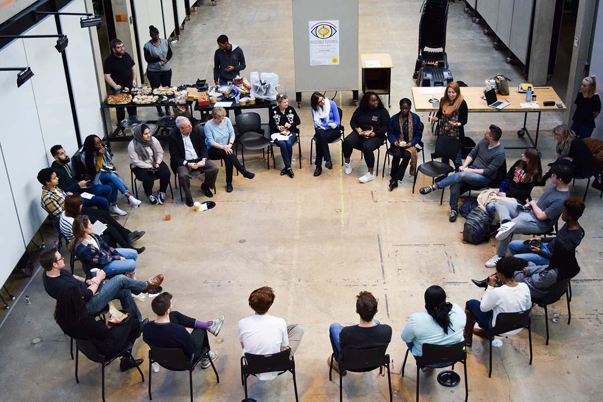 Students sitting in a circle in chairs