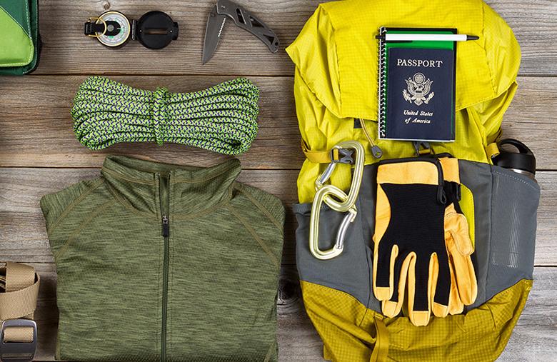 Hiking apparel and clothing including rope, gloves, clothes, backpack and a U.S. passport