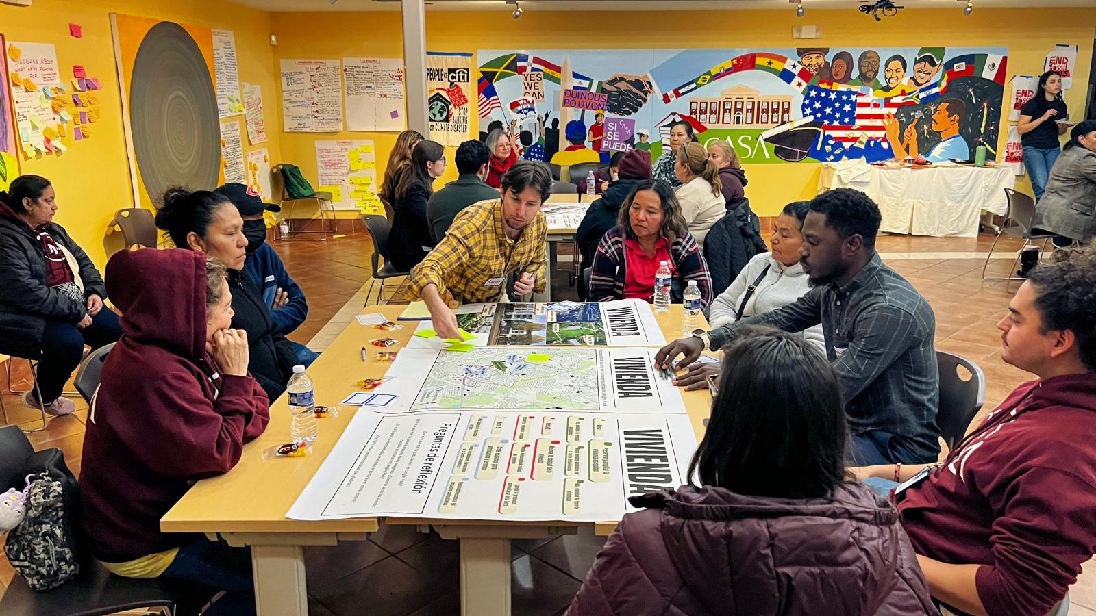 People sitting around a sitemap of Langley Park