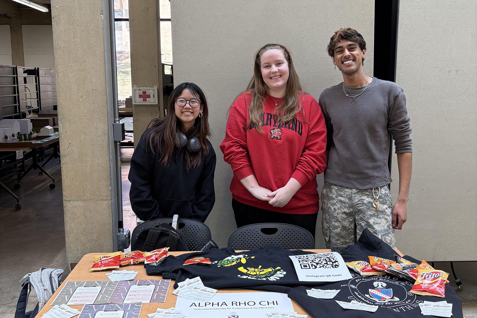 Three smiling students