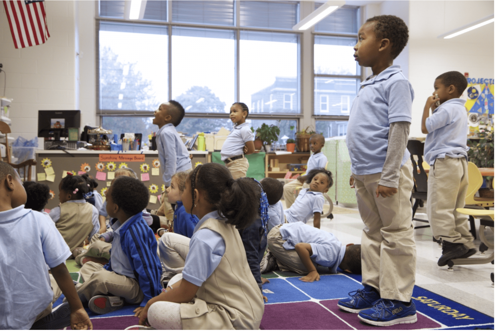 Young children wearing uniforms in elementary school