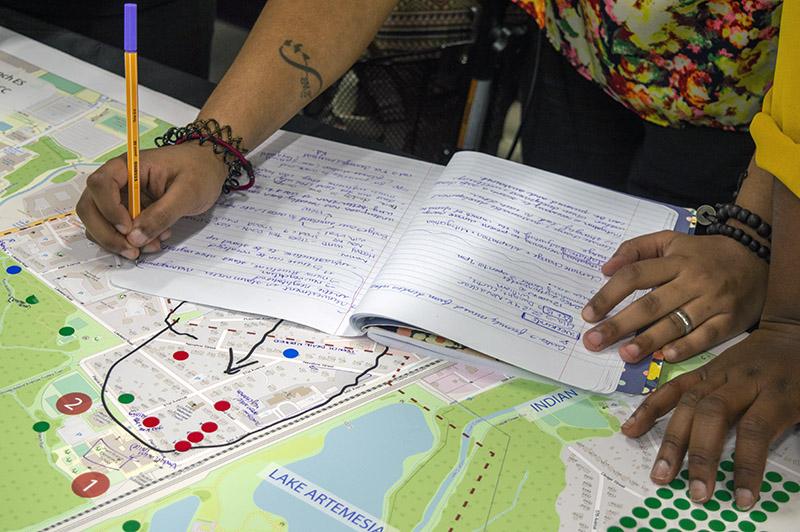 Close up of person designing a map