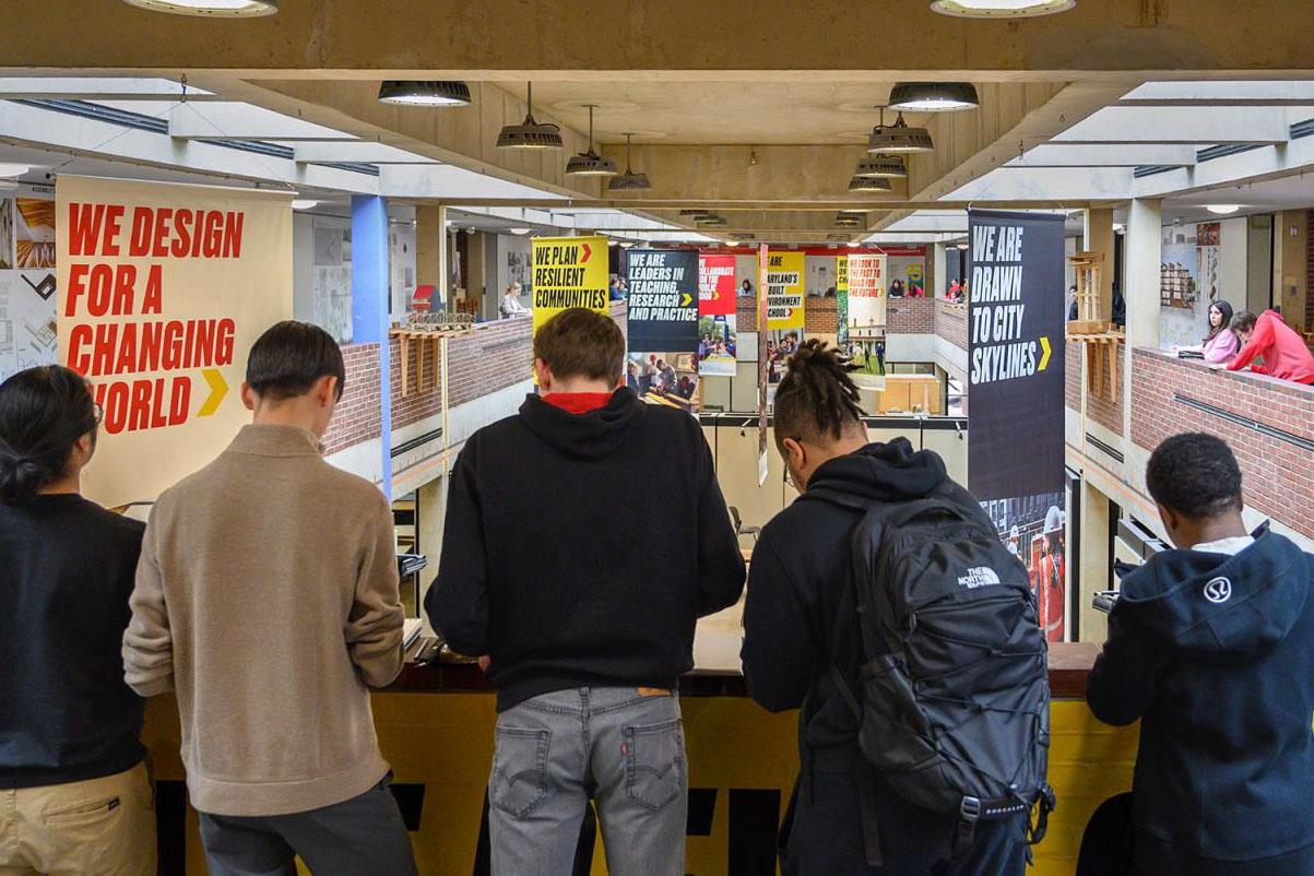 Students facing a great hall on the second floor