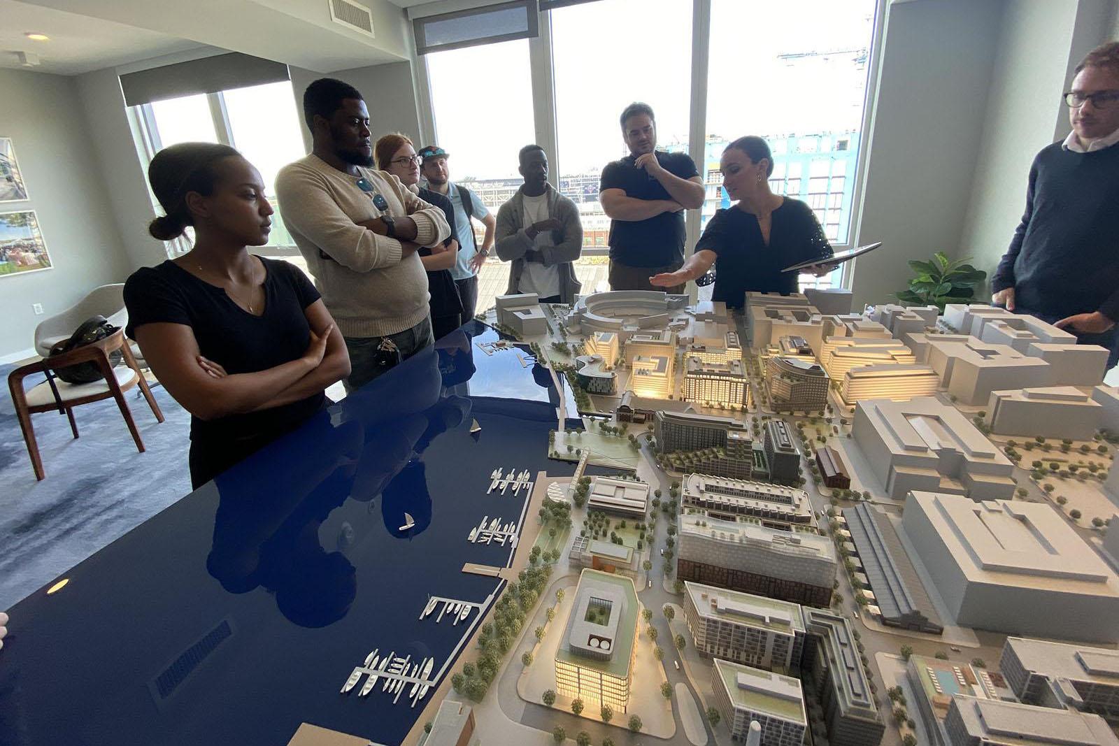 Students around a large model of navy yard