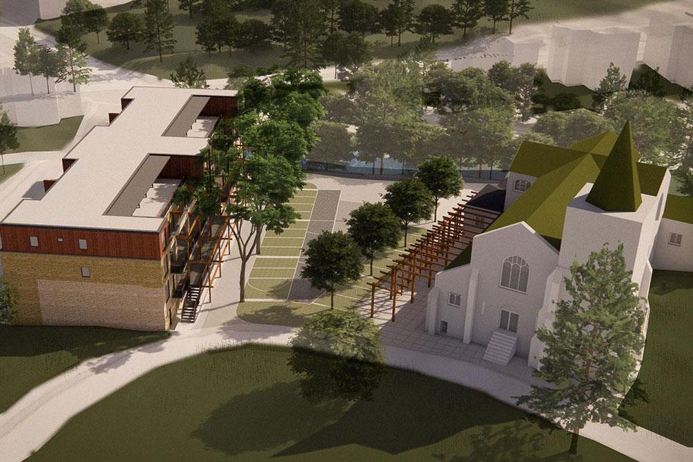 Birds eye view of a model building with trees and green space