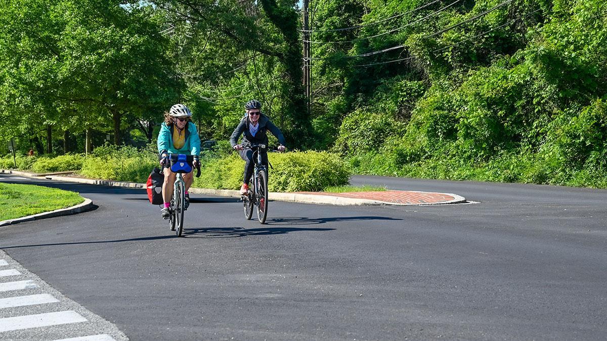 Katie Howell and Maggie Haslam biking to work