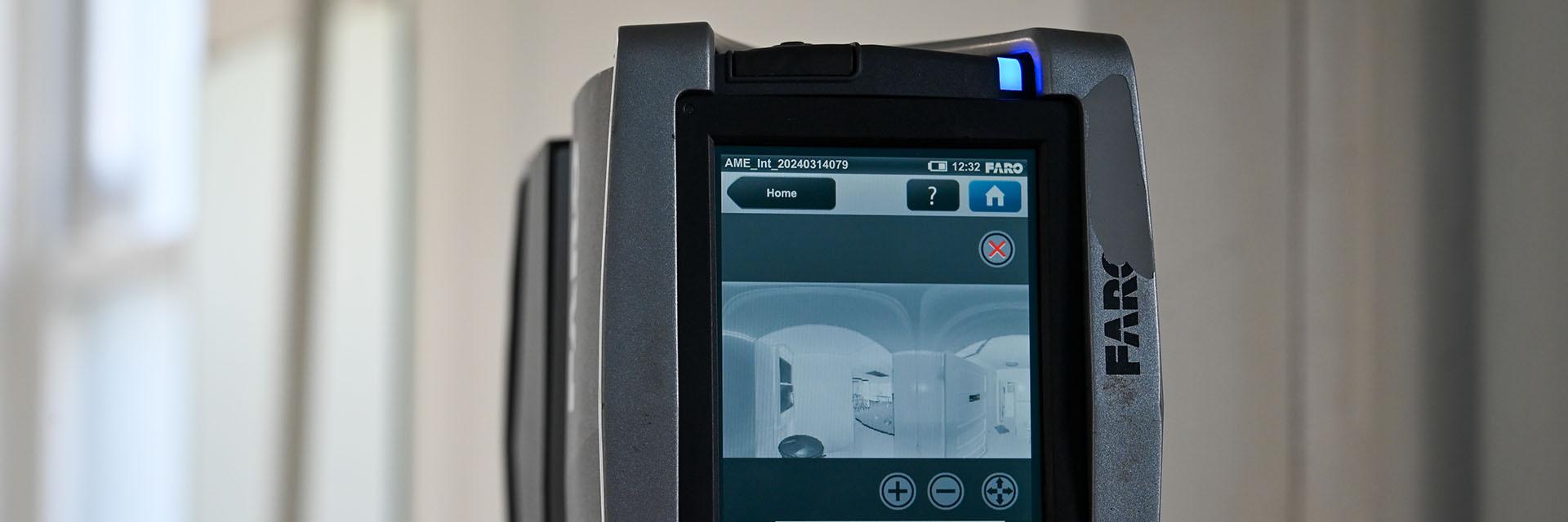 Closeup view of a Lidar camera scanning a room