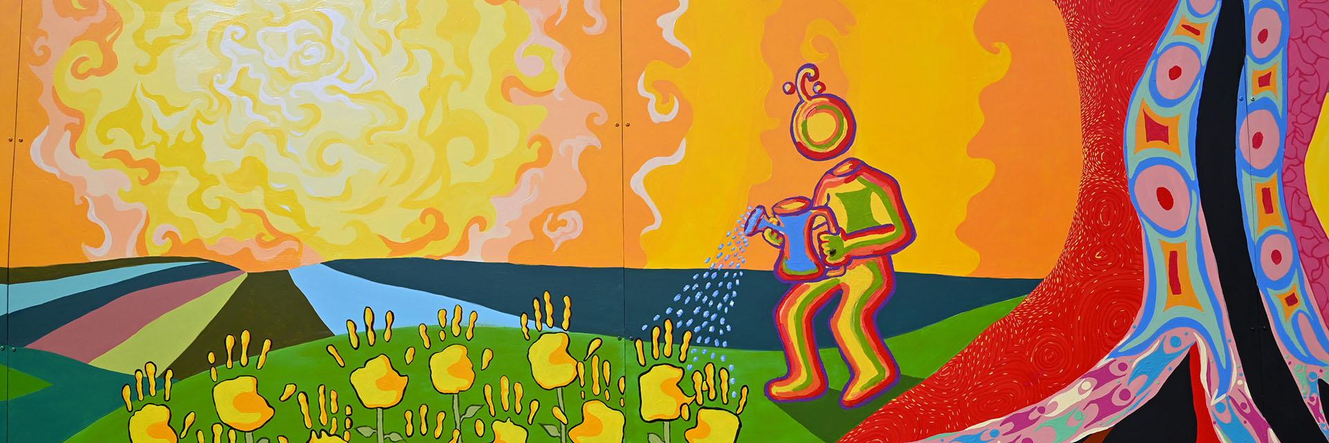 Vibrant wall mural of a person standing by a tree trunk watering flowers made of hands and a bright squiggly sun shines. 
