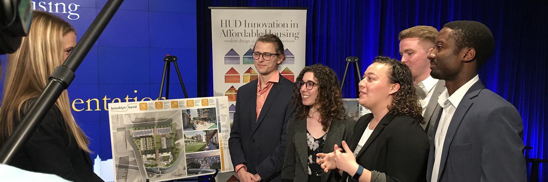 Students being interviewed after a competition win